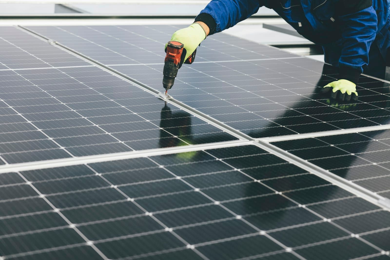 Technician installing a solar panel